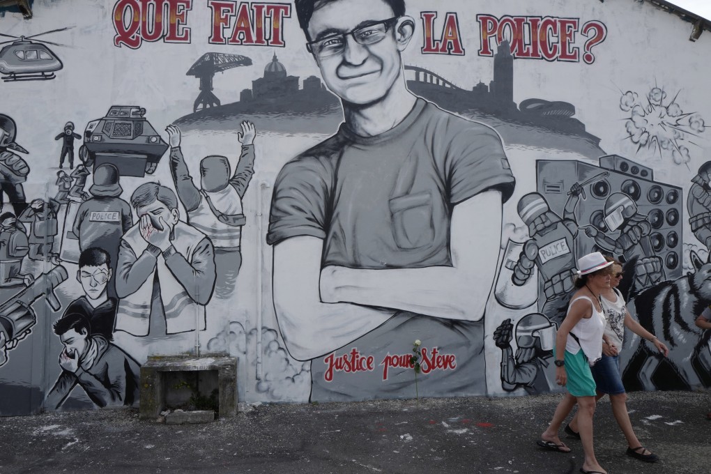 A mural depicting Steve Maia Canico, who drowned following a violent clash between police and people attending a music festival. Photo: EPA