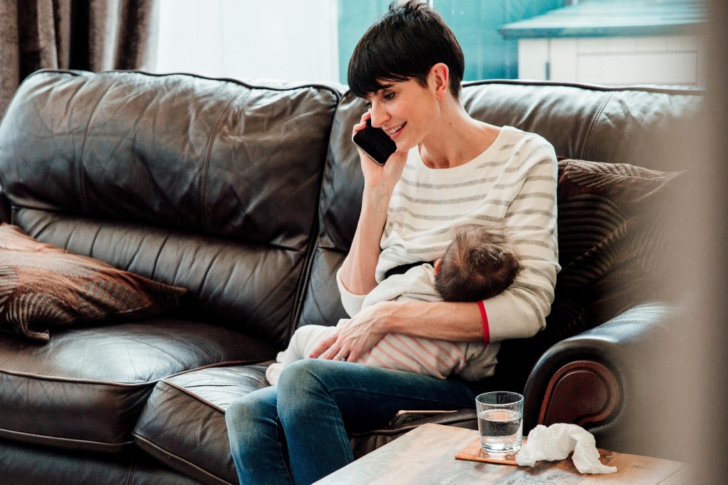 Is using your smartphone while breastfeeding bad for the bond with your baby? New Hong Kong mothers say it is not a problem and the smartphone stops them feeling isolated. Photo: Alamy