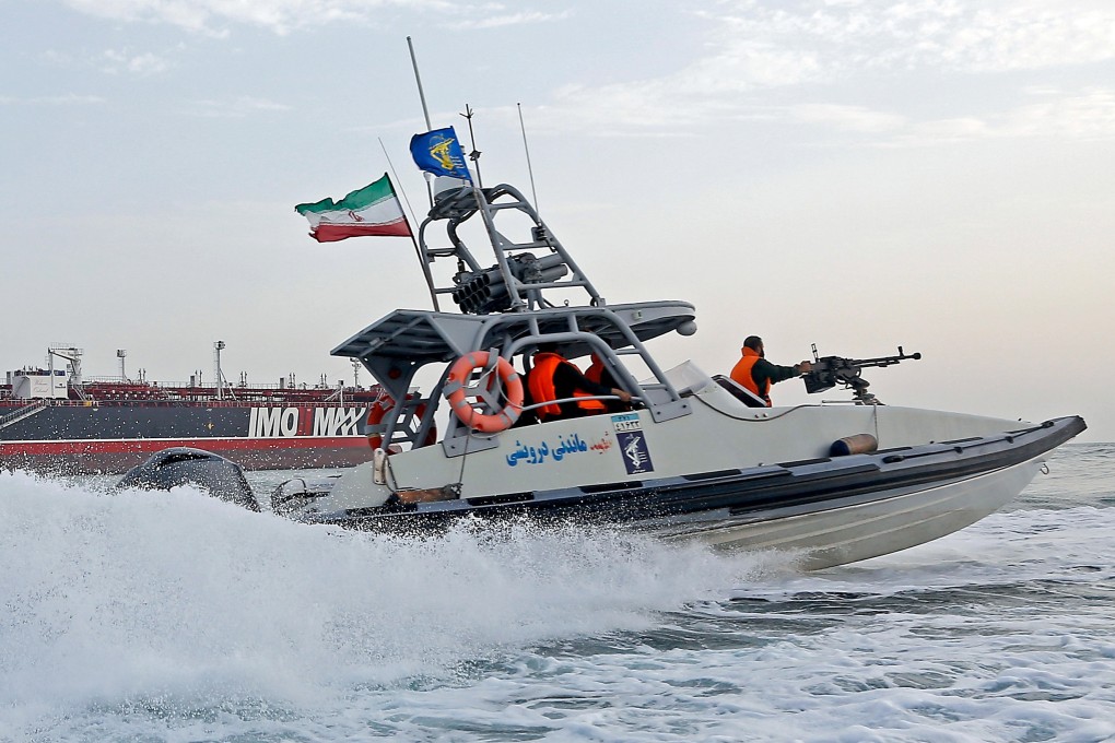 An Iranian Revolutionary Guard jet boat sails around a seized tanker in Bandar Abbas, southern Iran on July 21. Photo: EPA
