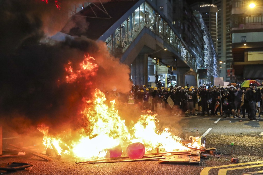 Bins and pieces of wood were set alight in Causeway Bay, Hong Kong Island. Photo: Sam Tsang
