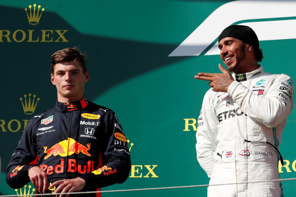Mercedes’ Lewis Hamilton celebrates winning the Hungarian Grand Prix as Red Bull’s Max Verstappen looks on, on Sunday. Photo: Reuters