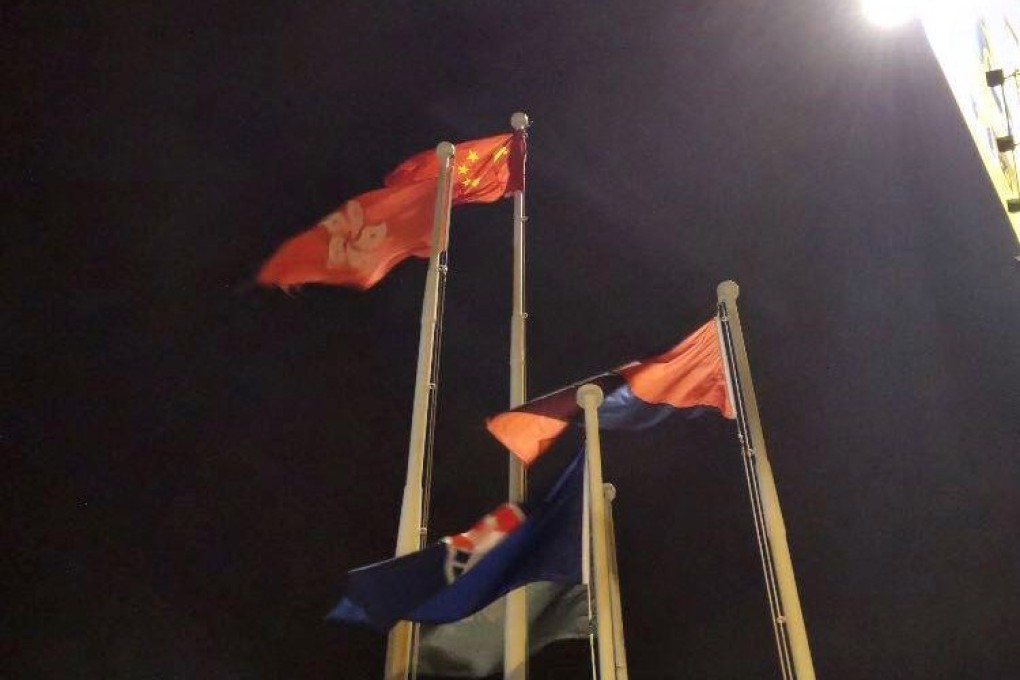 The Chinese national flag flies over Tsim Sha Tsui in Hong Kong on Saturday night. Photo: Huanqiu.com