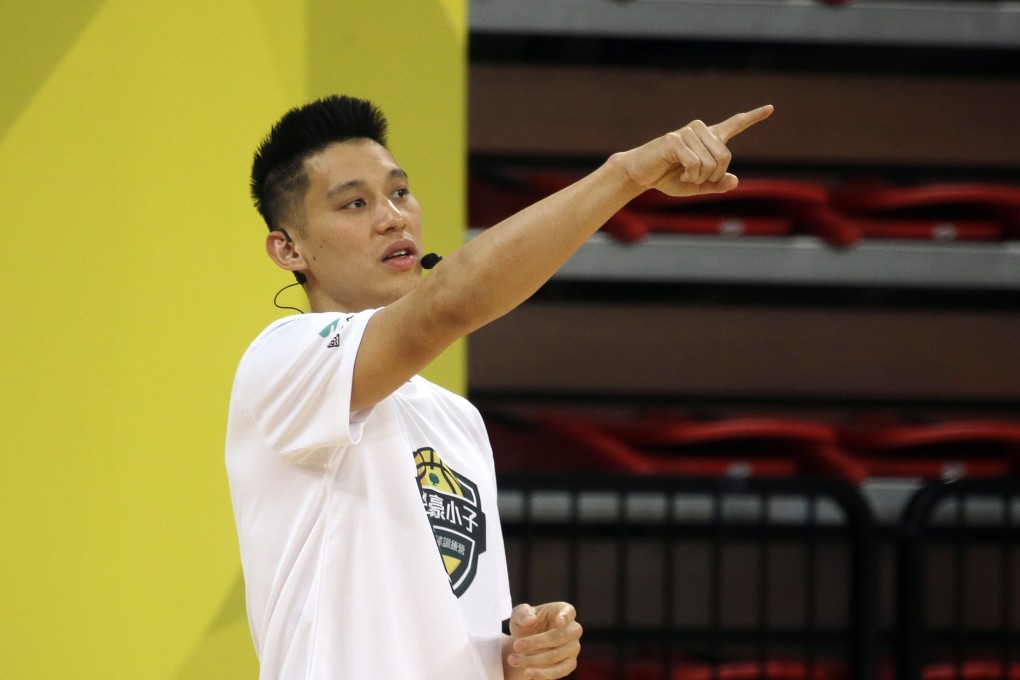 Former Toronto Raptors' Jeremy Lin, currently a free agent, speaks to young Taiwanese players during a basketball clinic in Taipei. Photo: AP