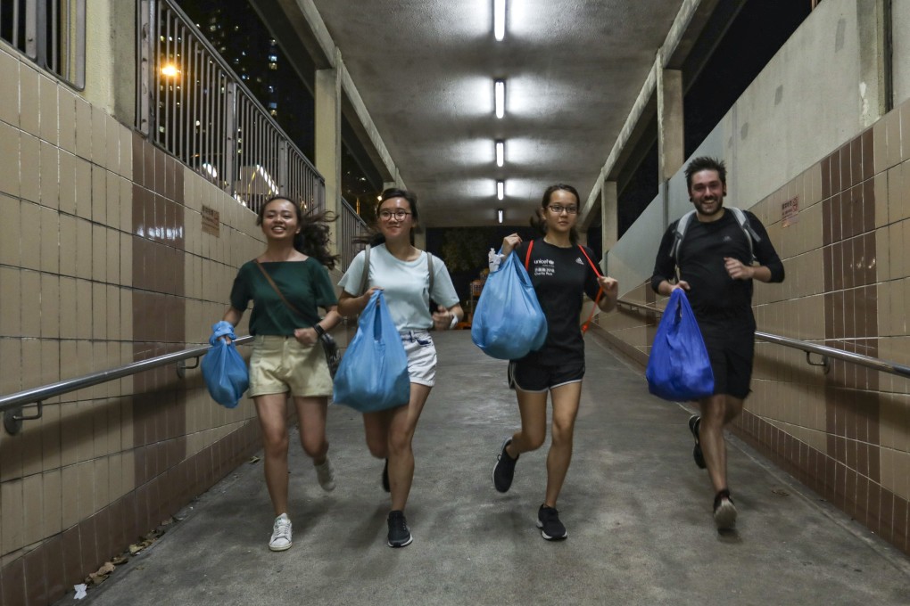 James Marlow (far right), founder of Waste Free Hong Kong, and volunteers take part in a bun run in Western District on July 17. Photo: Tory Ho