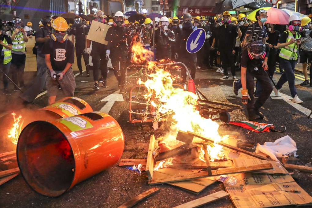 Riot police officers clash with anti-extradition bill protesters in Causeway Bay on Sunday, August 4. Photo: Sam Tsang