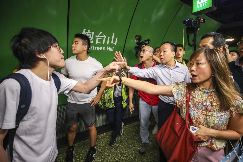 Commuters clash with anti-government protesters at Fortress Hill Station on Monday. Photo: Winson Wong
