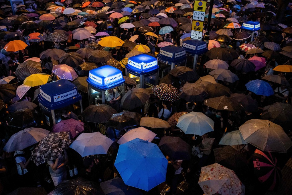 People attend a protest held by civil servants in Central district on August 2. Photo: AFP