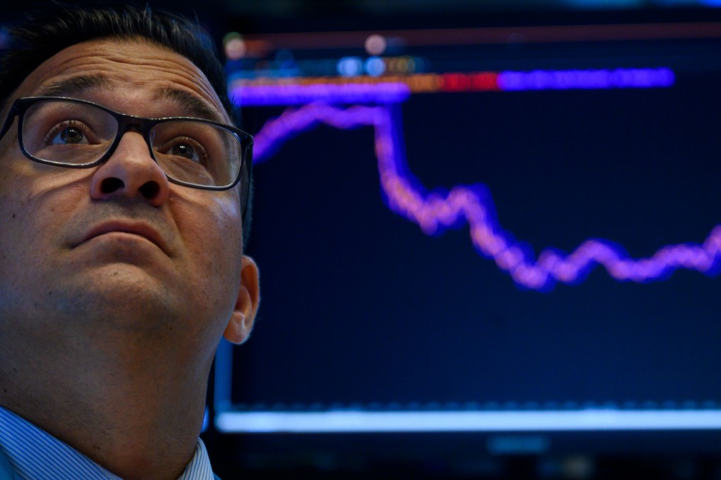 Traders work at the New York Stock Exchange on August 5, 2019 at Wall Street in New York City. Selling on Wall Street accelerated early on Monday as a steep drop in the Chinese yuan escalated the US-China trade war following President Trump's announcement of new tariffs last week. Photo: AFP