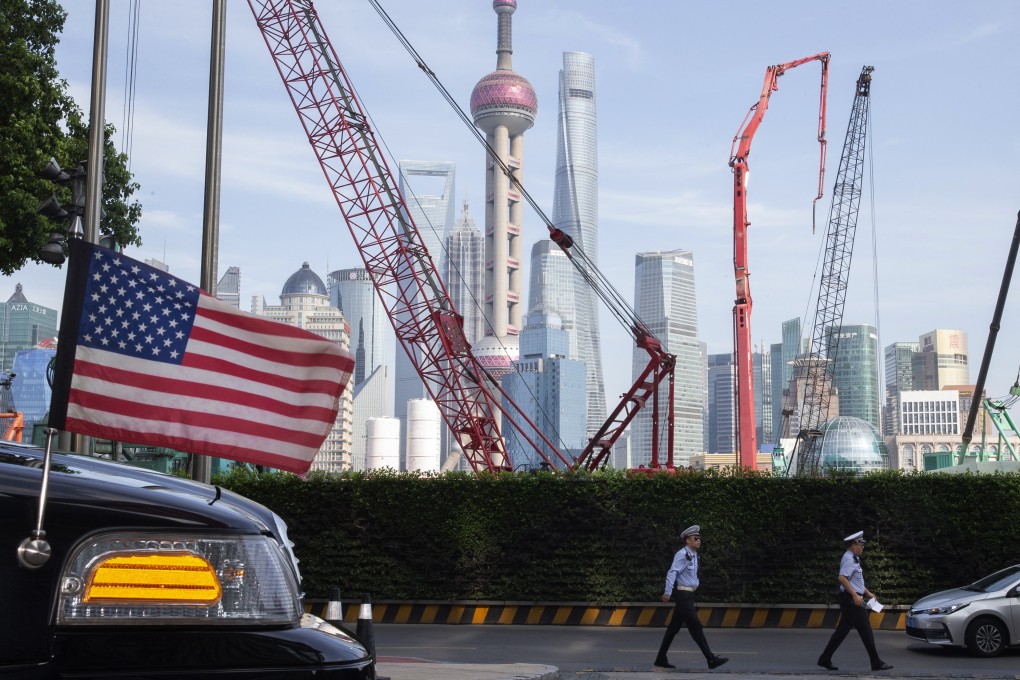 Chinese traffic police walk past a US embassy car parked outside a hotel in Shanghai on July 30, when negotiators from both sides were holding trade talks. Just days later, US President Donald Trump announced new 10 per cent tariffs on US$300 billion worth of Chinese goods, starting in September. Photo: AP