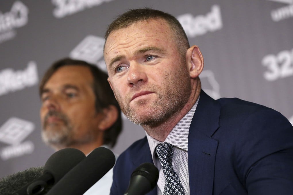 Wayne Rooney sits alongside Derby County manager Phillip Cocu at the press conference announcing his move from MLS side DC United. Photo: AP