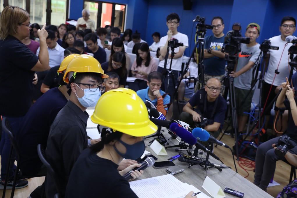 The three protesters meet the press in Mong Kok. Photo: Sam Tsang