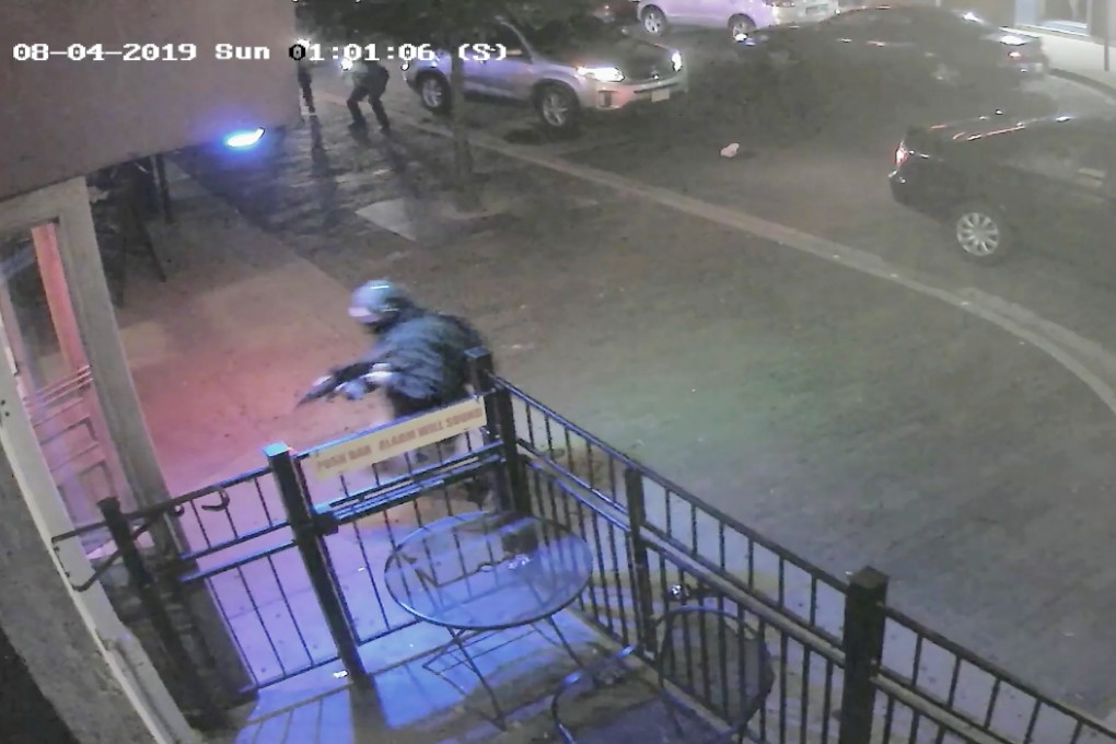 A screen grab from a surveillance video shows several officers (top left and right) firing at and killing Connor Betts (bottom left at doorway) seconds after he began killing people outside a bar in Dayton, Ohio. Photo: Dayton Police Department via EPA-EFE