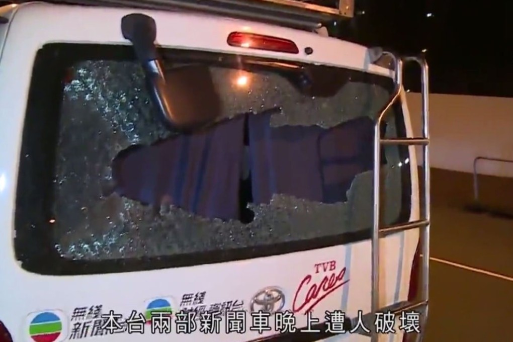 Screen grab of TVB broadcast showing one of the station’s vans after it was attacked by protesters during clashes at Wong Tai Sin in the early hours of Monday morning. Photo: SCMP Pictures