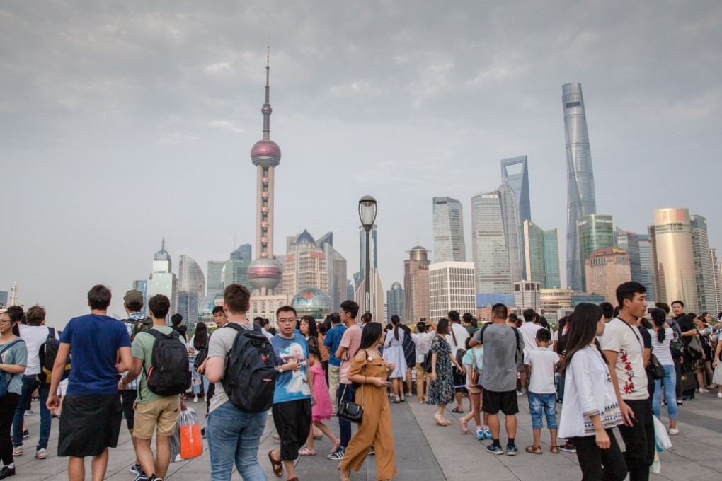 Tourists from near and far taking in the Shanghai skyline from the Bund on 26 October 2017. Photo: SCMP/Features Travel