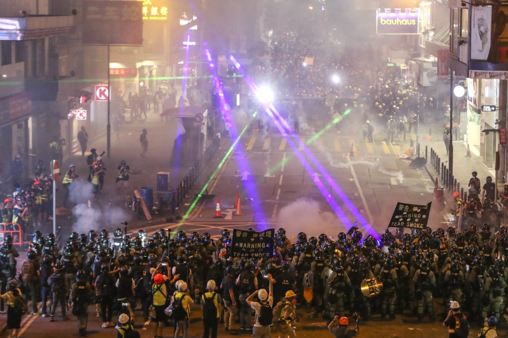 Riot police clash with anti-extradition bill protesters in Causeway Bay on August 4. Photo: Winson Wong