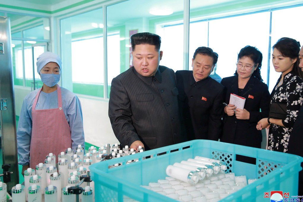 North Korean leader Kim Jong-un and his wife, Ri Sol-ju, visit a cosmetics factory in Pyongyang. Photo: Reuters