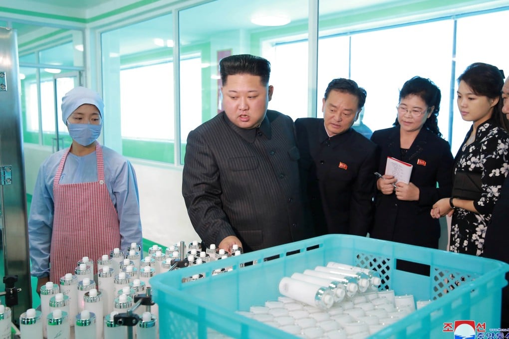 North Korean leader Kim Jong-un and his wife, Ri Sol-ju, visit a cosmetics factory in Pyongyang. Photo: Reuters