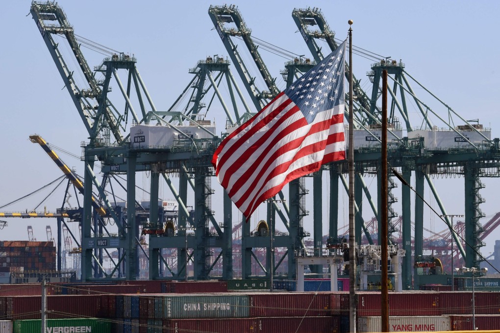 The US collected 74 per cent more tariffs in June than it did in June 2018, according to a new report. Pictured, a US flag flies over Chinese shipping containers at the Port of Long Beach in California. Photo: AFP