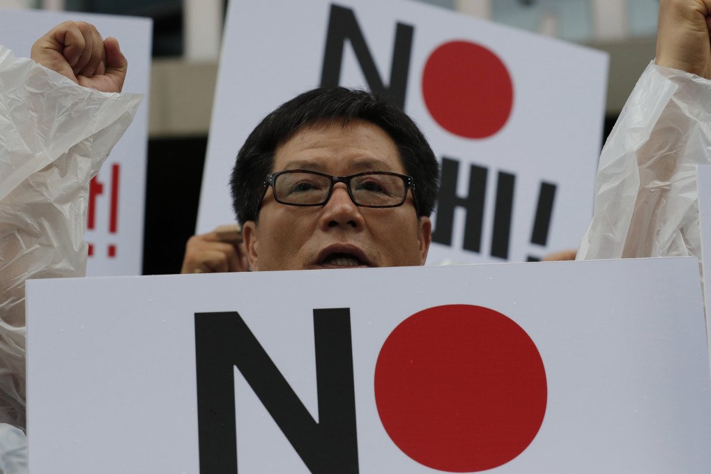 Protesters in front of the Japanese embassy in Seoul. Photo: AP