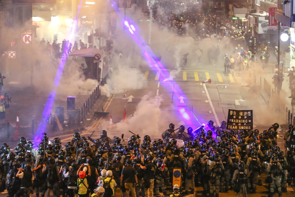 Riot police fire tear gas during a clash with anti-government protesters in Causeway Bay. Photo: Winson Wong