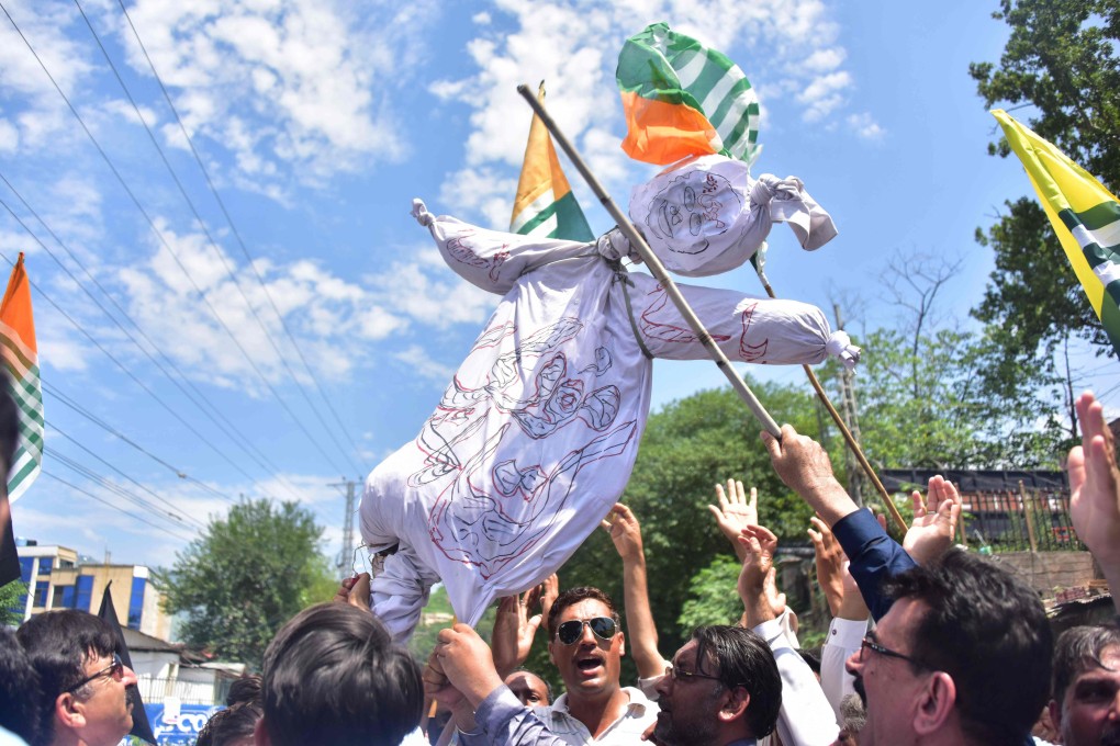 Pakistani Kashmiri hold an effigy of Indian Prime Minister Narendra Modi during a protest in Muzaffarabad, the capital of Pakistan-controlled Kashmir, on Thursday. Photo: AFP