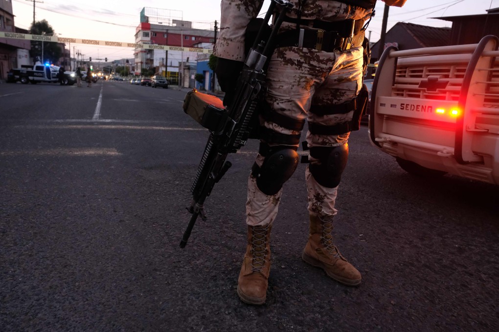 Mexican soldiers guard a crime scene in downtown Tijuana in April 2019. Photo: AFP