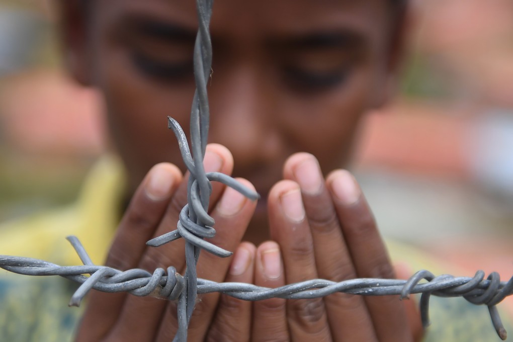 A Rohingya refugee prays at the Kutupalong refugee camp in Ukhia, Bangladesh, on August 25, 2018. Photo: AFP