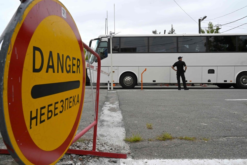 A tourist bus enters the Chernobyl exclusion zone on August 1. Photo: AFP