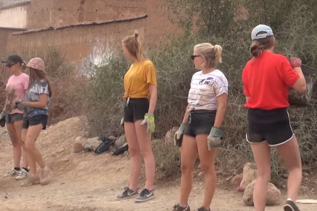 A screen grab from a video showing some of the volunteers at work in Morocco. Photo: al3omk.com via YouTube