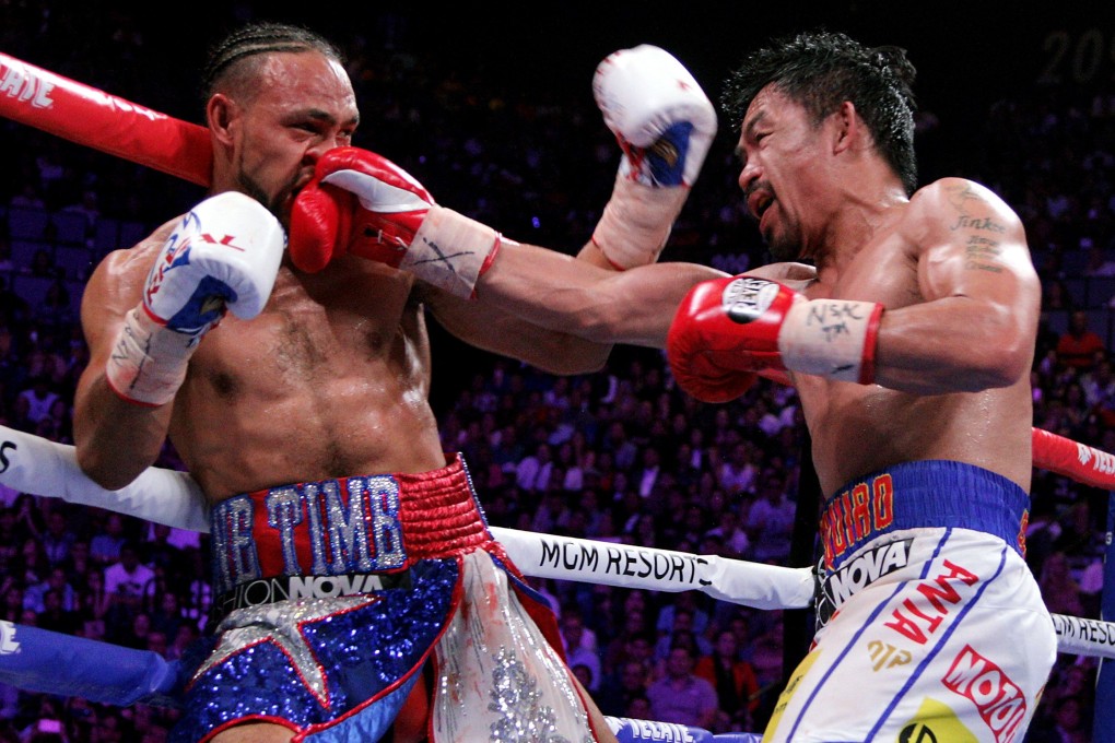 Manny Pacquiao slams a right to the face of Keith Thurman. Photo: AFP