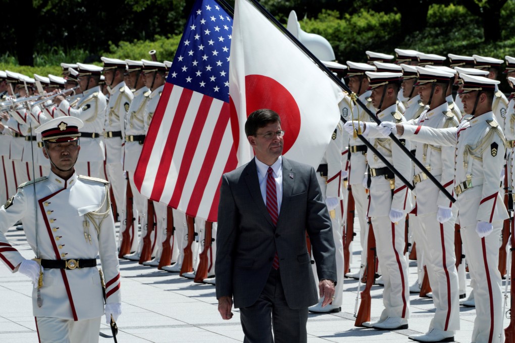 US Secretary of Defence Mark Esper inspects an honour guard ahead in Tokyo, Japan. Photo: Reuters