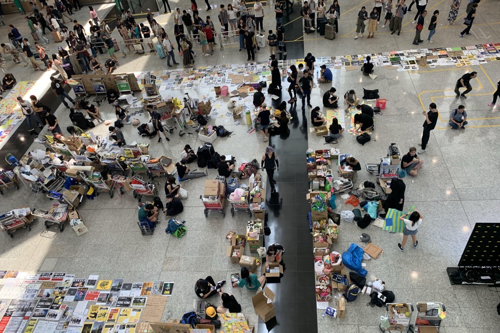 The scene at Hong Kong airport’s arrival hall on Sunday morning, with more protesters set to join in the afternoon. Photo: SCMP