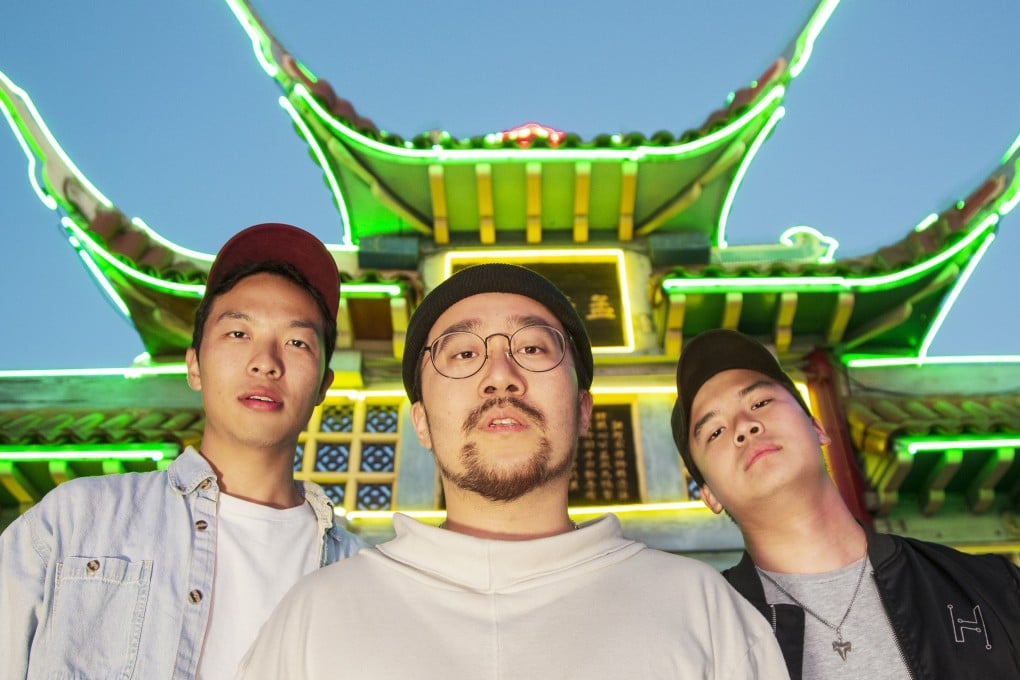 Nitemrkt’s Sakyboi (left), Jason Chu (centre), and Leo Xia in front of LA Chinatown’s iconic gate. Photo: Jon Delouz