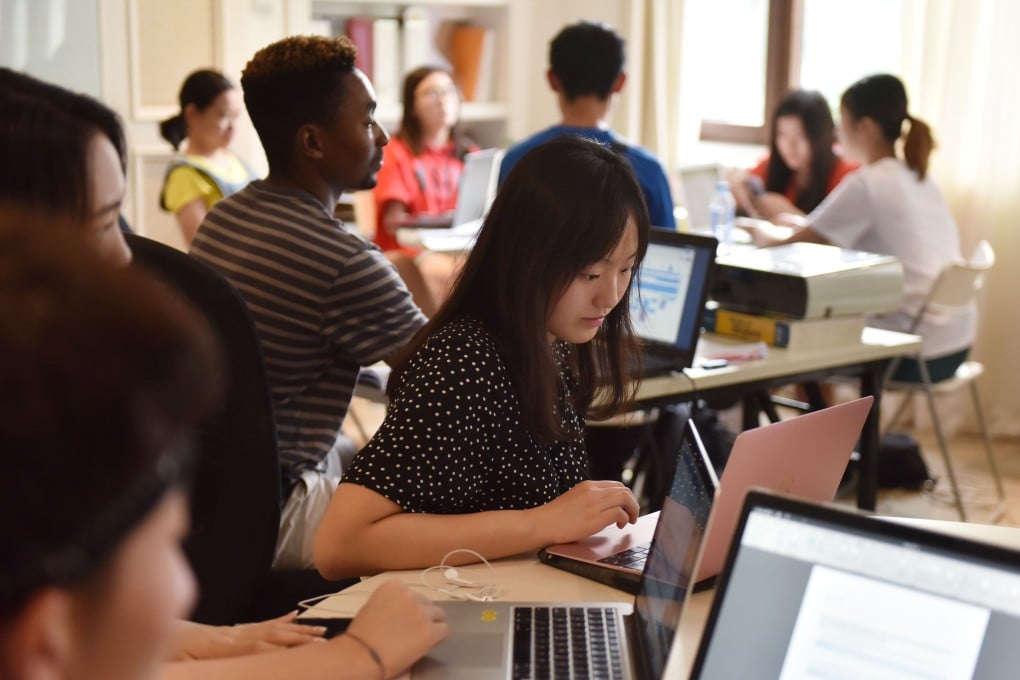 Students during a class at a boutique college consultancy in Beijing. Photo: AFP