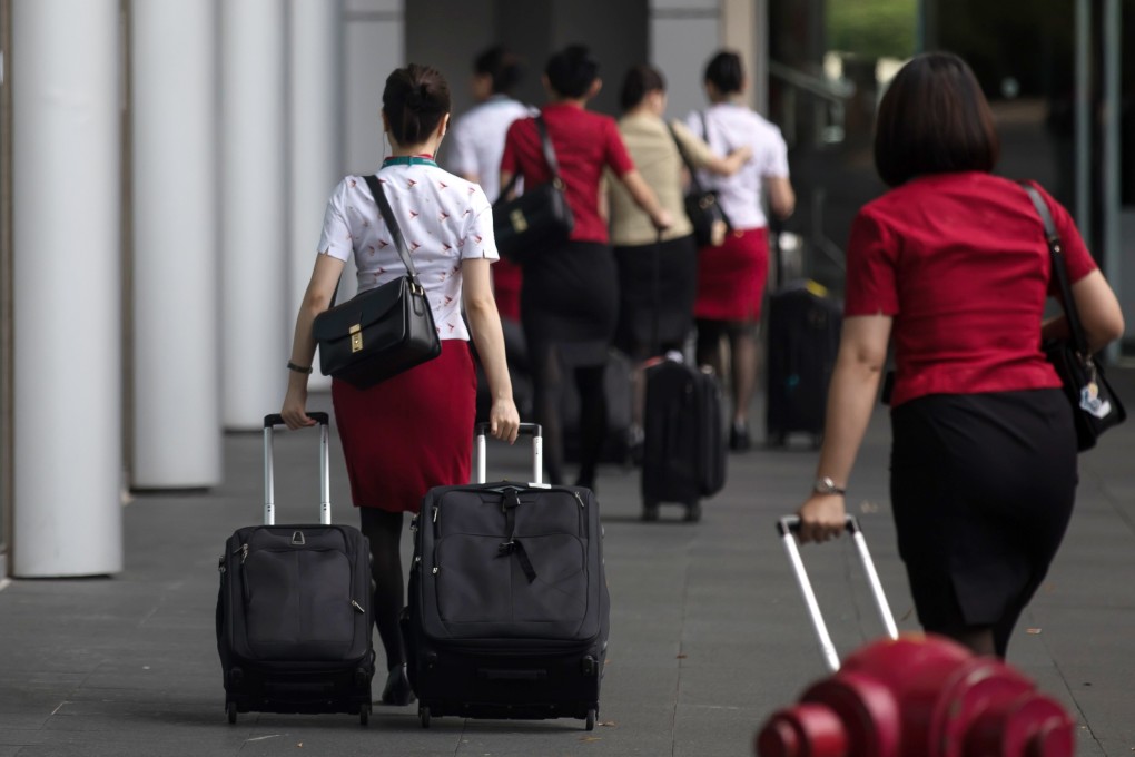 Cathay Pacific employees at the company's headquarters in Hong Kong. The city’s flag carrier has been caught up in the protest crisis. Photo: Bloomberg