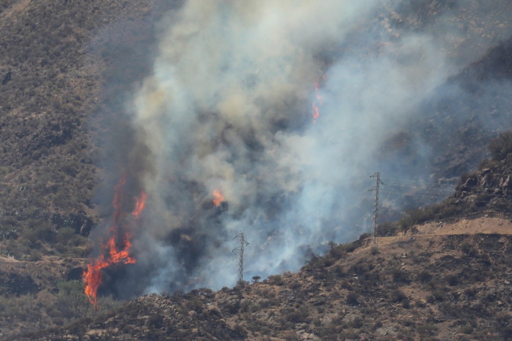 Smoke rises from a forest fire in Tejeda, Gran Canaria. Photo: EPA-EFE