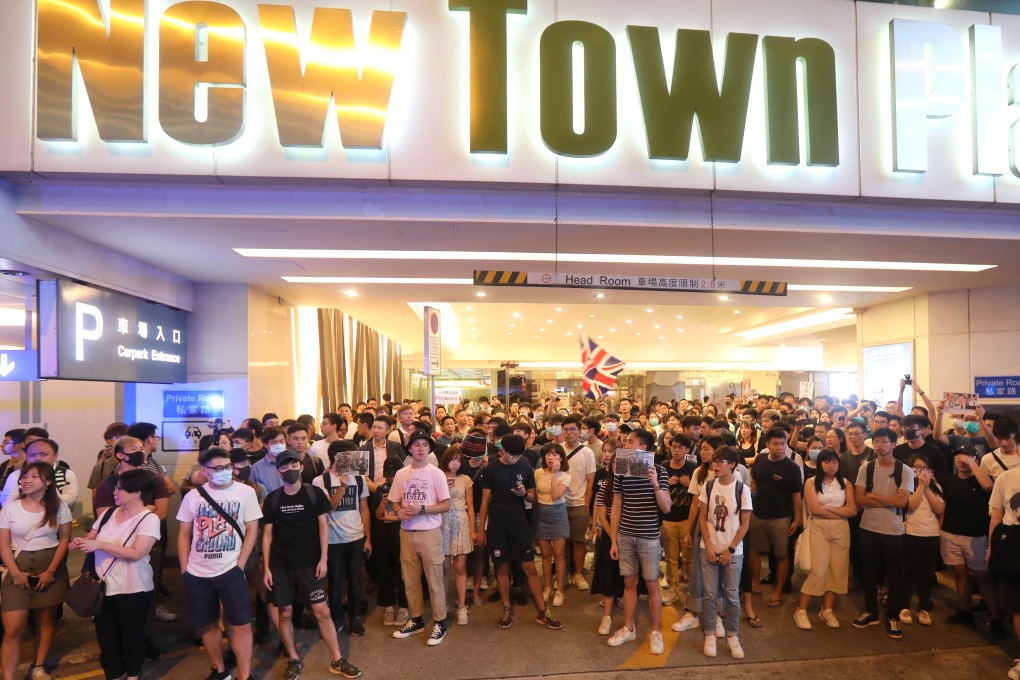 People gather at the New Town Plaza shopping mall in Hong Kong’s Sha Tin district to demand an explanation after police entered the premises to clear protesters following an anti-extradition demonstration on July 14. Photo: Stanley Shin