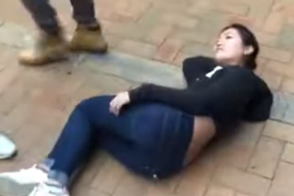A screenshot from the video shows 27-year-old Hongkonger Serena Lee on the ground after being shoved. Photo: YouTube
