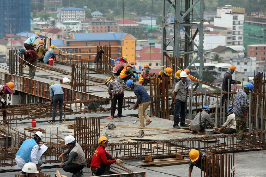 Cambodian labourers work on a high-rise construction site in Sihanoukville. Photo: AFP