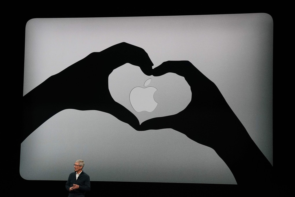 Apple CEO Tim Cook presents new products, including MacBook laptops, during an event in New York. Photo: AFP