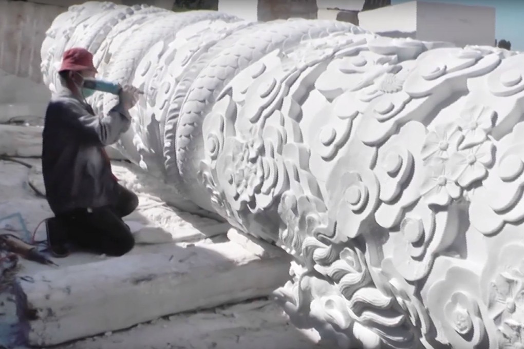A worker in Hebei province puts the final touches to the Chinese Labour Corps memorial. Photo: YouTube | TheCiBF