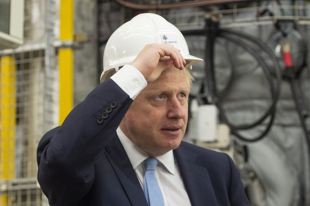 Britain's Prime Minister Boris Johnson, seen during a visit to the Fulham Science Centre in Oxfordshire on August 8, will have to put on his thinking cap to navigate the tricky US-China strategic dilemma as Britain prepares to leave the European Union. Photo: AFP