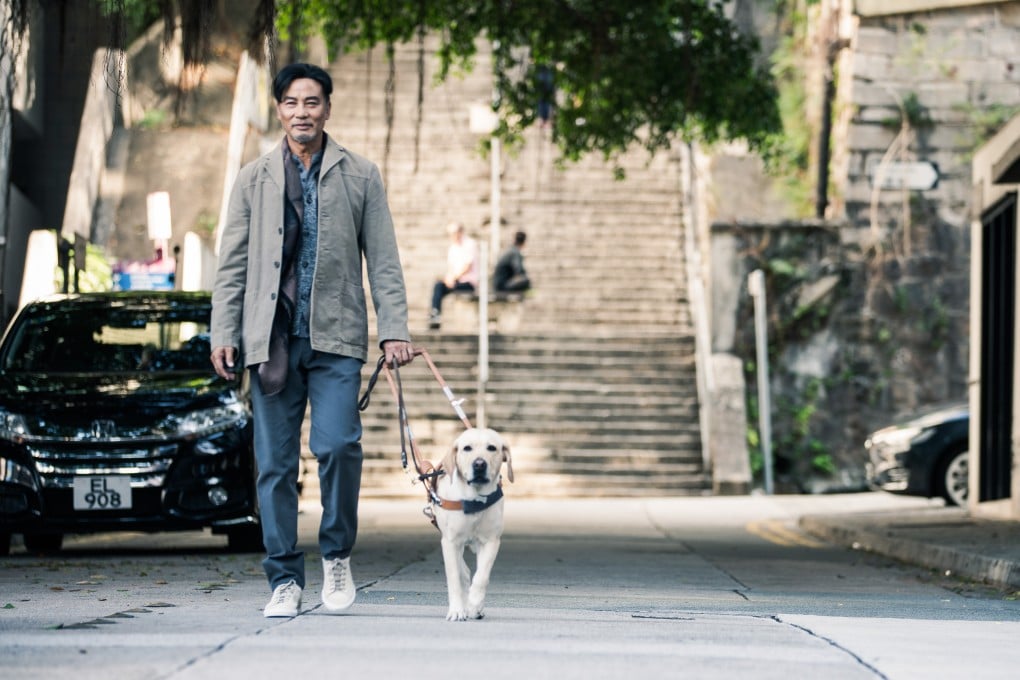 Simon Yam and his co-star in a street scene from Little Q (category IIA; Cantonese), directed by Law Wing-cheong. Him Law and Gigi Leung co-star.