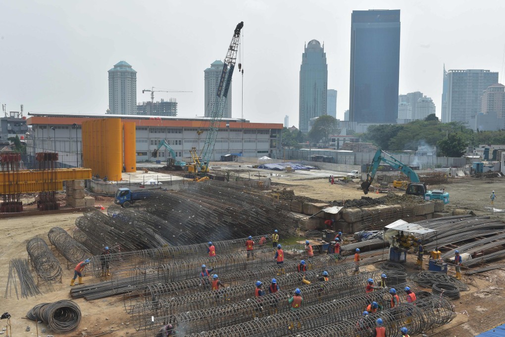 Indonesian labourers work on a construction site in Jakarta. Photo: AFP