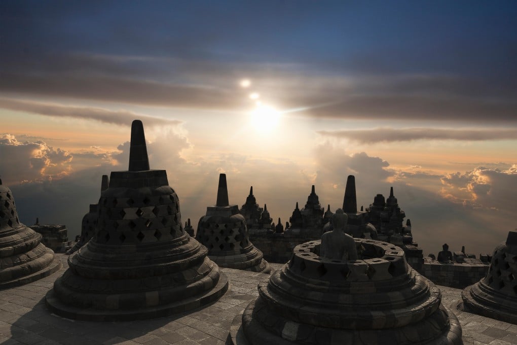 F11G0T Spires on Temple of Borobudur at sunset, Borobudur, Indonesia