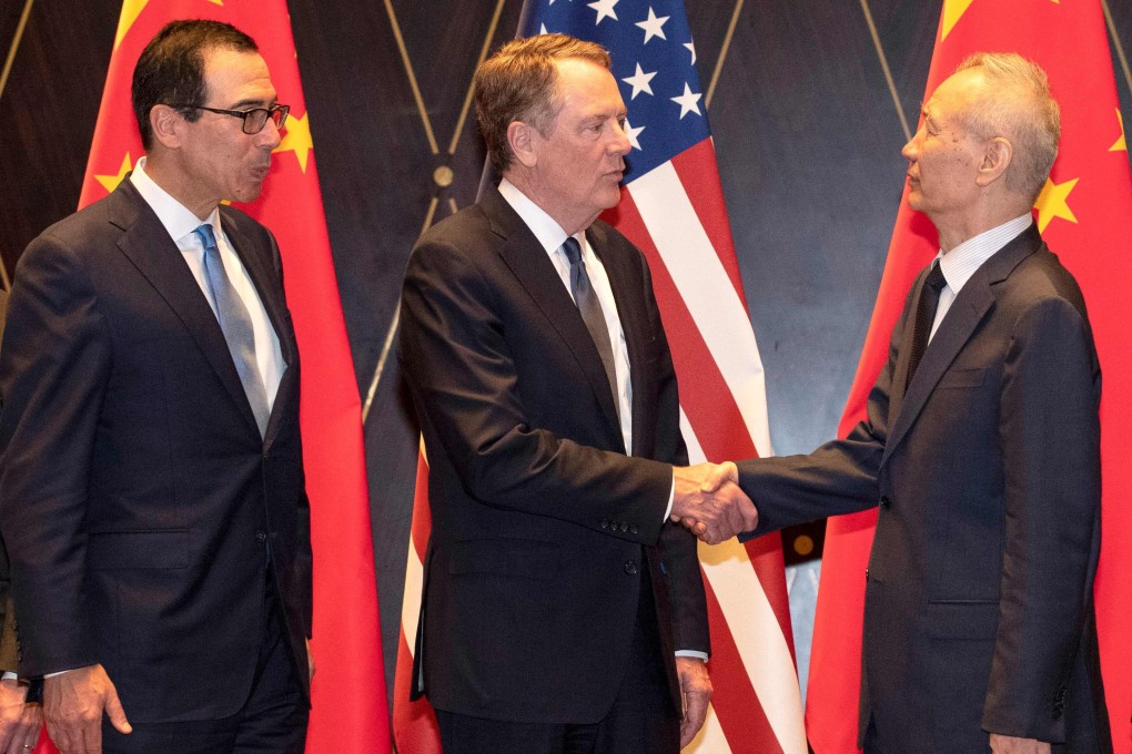 US Trade Representative Robert Lighthizer shakes hands with China's Vice-Premier Liu He in Shanghai in July as US Treasury Secretary Steven Mnuchin looks on. Photo: AFP