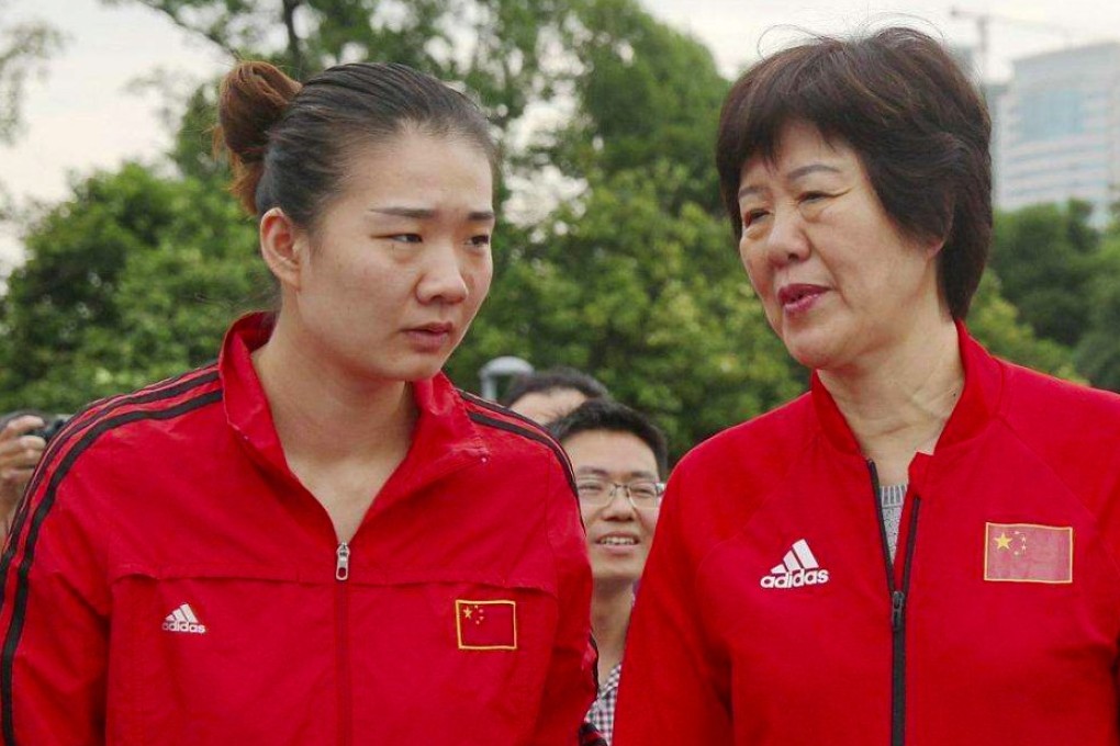 Yang Fangxu (left) and her coach Lang Ping. Photo: Handout