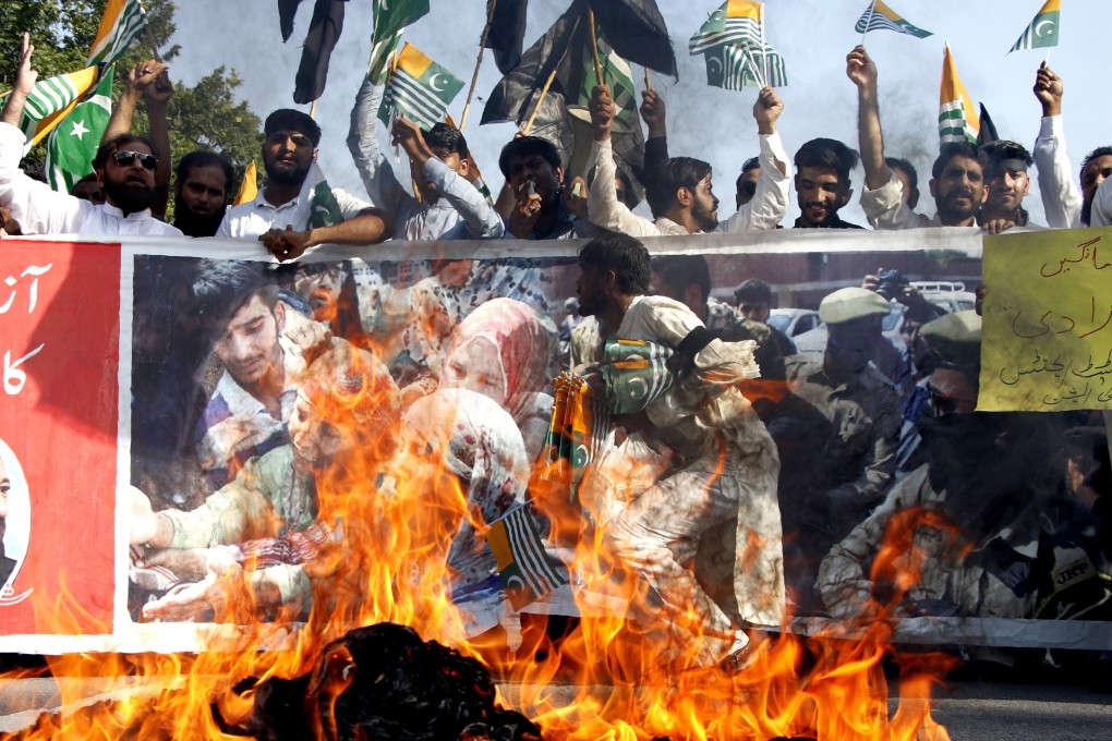 People shout slogans to in Pakistan on Thursday to protest New Delhi's move to revoke the special status of Jammu and Kashmir. Photo: EPA-EFE