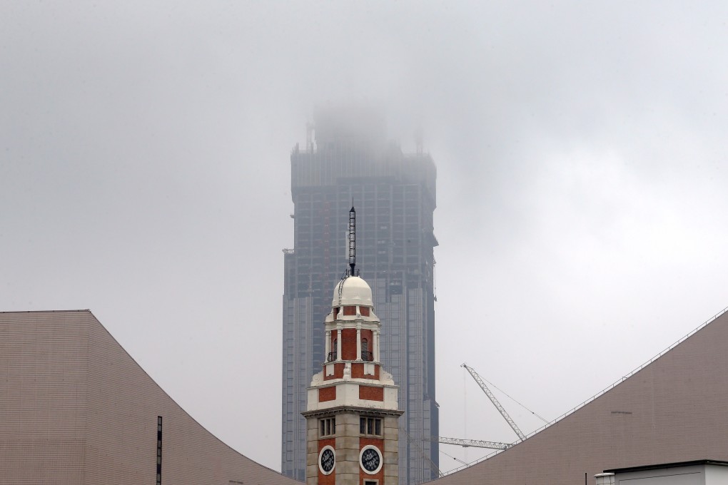 The clock tower rises out of the fog in Tsim Sha Tsui in March 2016. During the extradition bill protests on August 7, a man spray-painted a slogan on the tower. Photo: Felix Wong