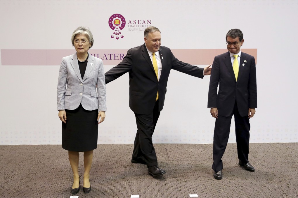 US Secretary of State Mike Pompeo, centre, gestures to his Japanese counterpart Taro Kono, right, and South Korean counterpart Kang Kyung-wha after a trilateral meeting in Bangkok. International observers warn that the fraying of ties between Seoul and Tokyo will have economic and security implications, and not just for them. Photo: AP